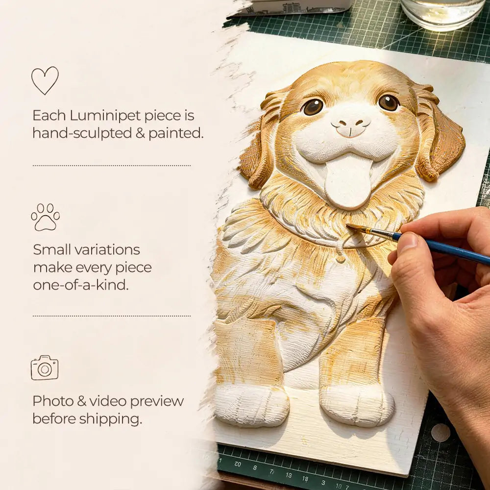 Luminipet artist hand-painting a raised dog relief portrait during the sculpting and finishing process